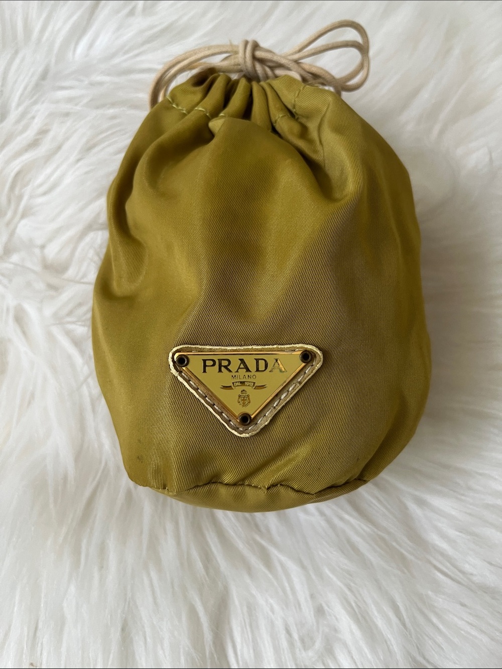 Prada mustard Drawstring Cosmetic Pouch with Gold Logo. Mini bag made of nylon .